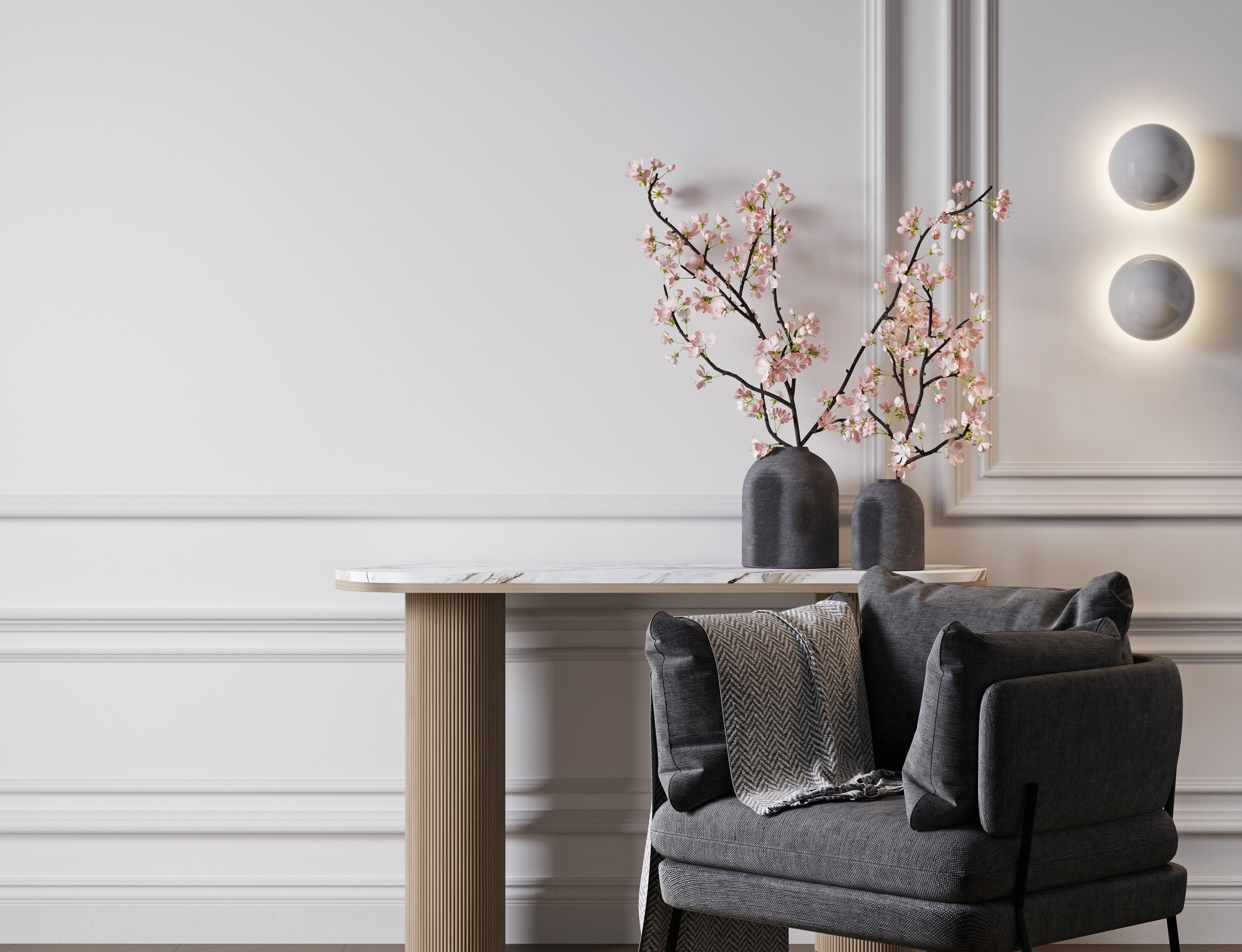 Modern interior with a gray armchair, wooden table, and decorative plants.